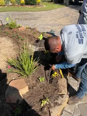 Mr Sprinkler Repair technician working on landscaping in San Antonio TX